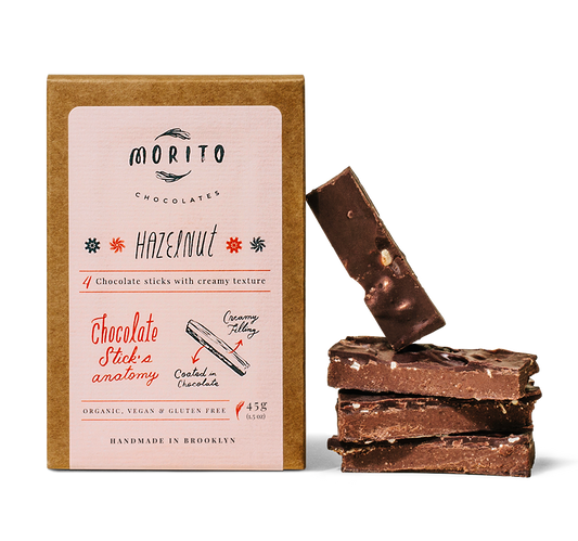 Our signature chocolate stick. Balanced, nutty, and fruity profile in combination with the beautiful hazelnut flavor. Topped with roasted chopped hazelnuts. Made with 68% cacao, organic dark chocolate.  These Hazelnut chocolate sticks are organic, vegan, gluten-free and low in sugar. We use simple ingredients, and produce our chocolates in small batches without added preservatives.